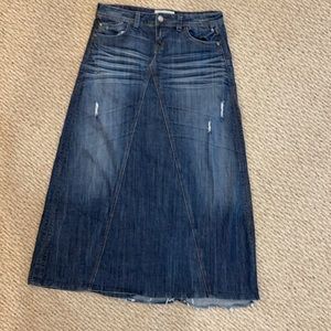 Long a line denim skirt; raw hem; distressed